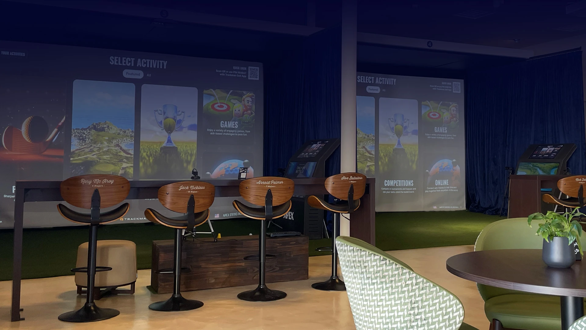 The simulator lounge and seating area at APEX Swing Academy