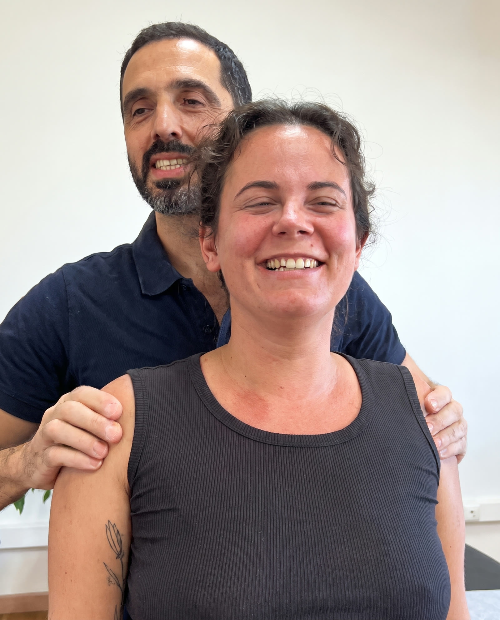 Smiling FITQOR client with osteopath