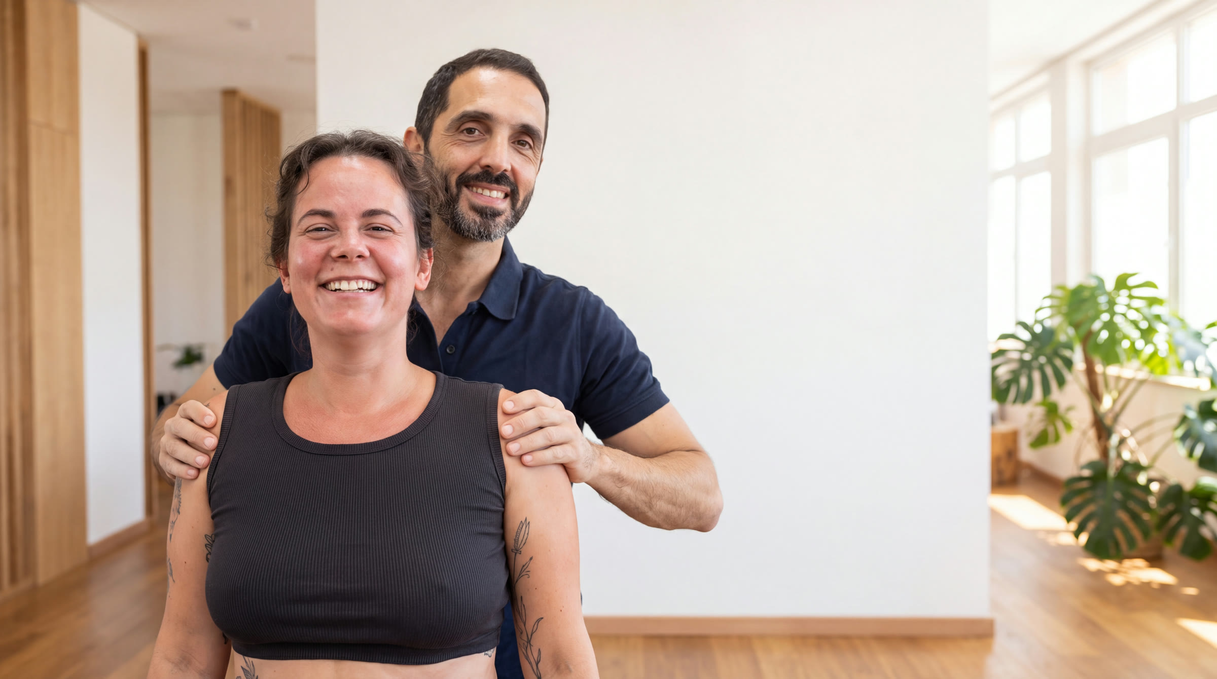 Osteopath and client smiling at FITQOR Wellness Club